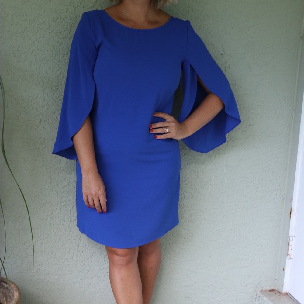 Gorgeous blue dress with cape sleeves.